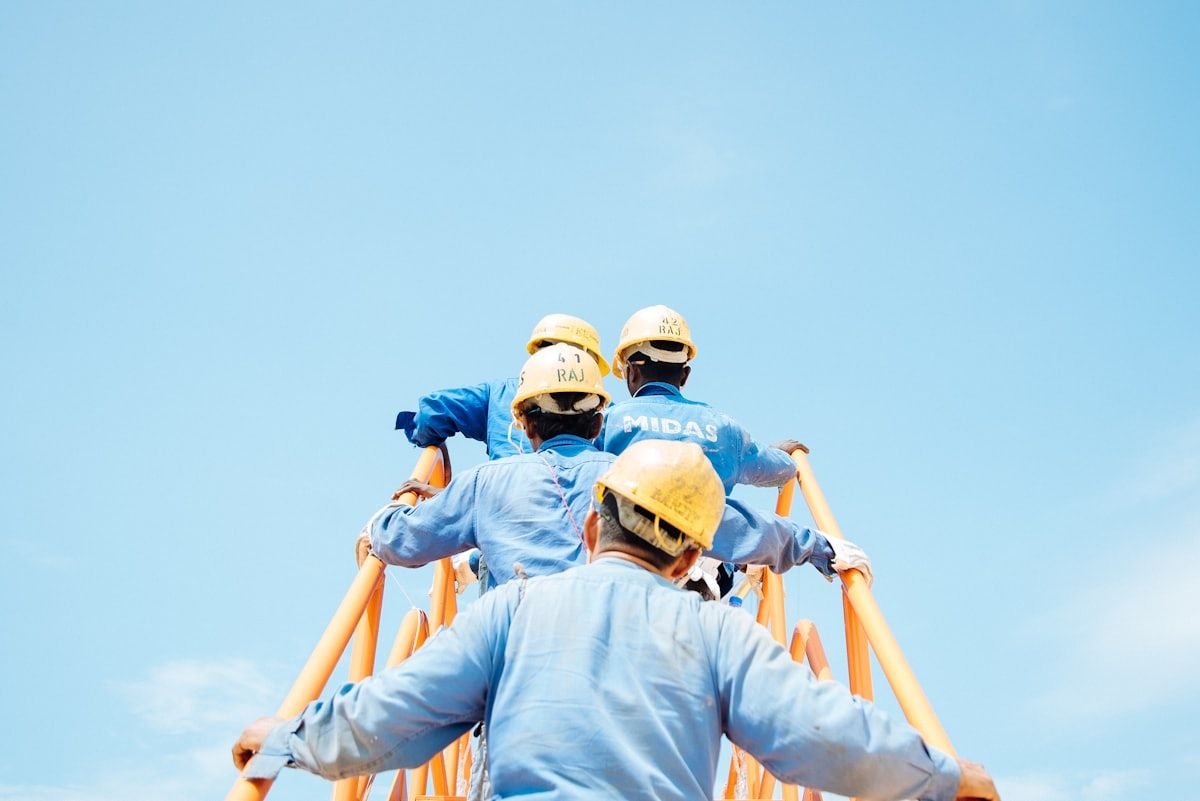 Crew of tradespeople working together on a building project